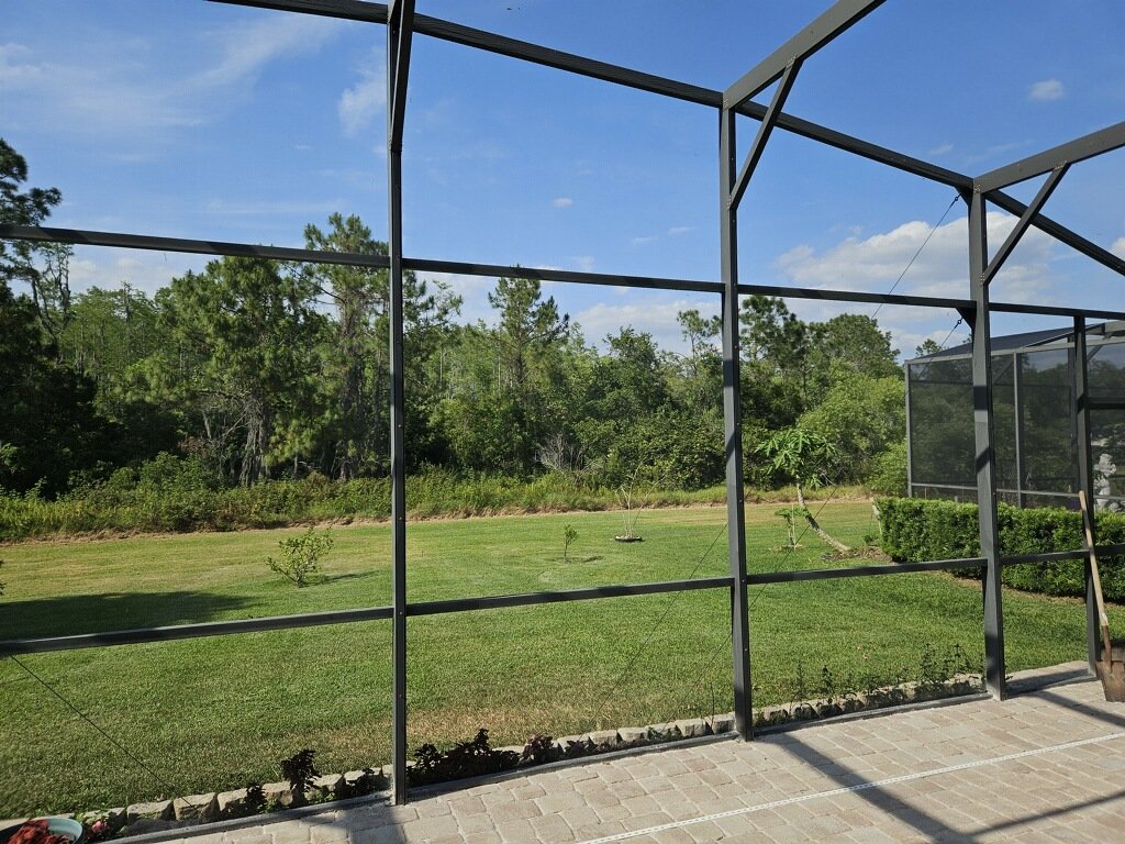Naples Pool Screen Repair. Pool cage screen enclosure view in Naples Florida